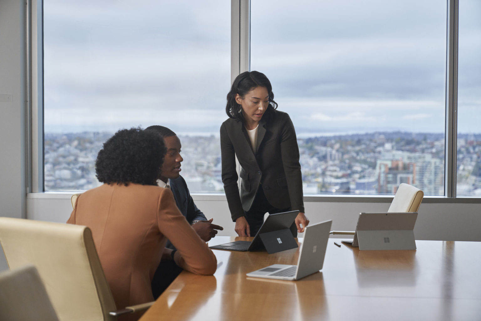 Three people with Surface devices