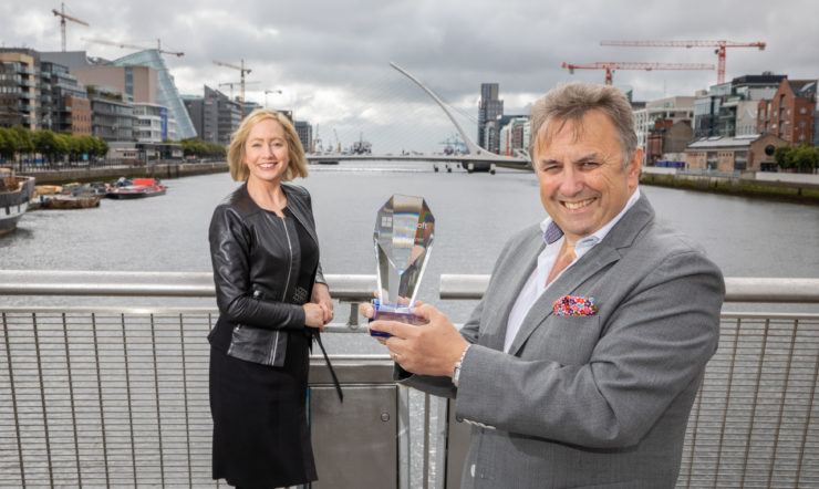 Aisling Curtis, John Purdy standing next to a dock