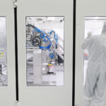 Two Engineers preparing to service a clean room