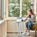 Woman sitting in chair inside