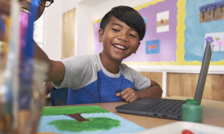 Student smiling in the classroom